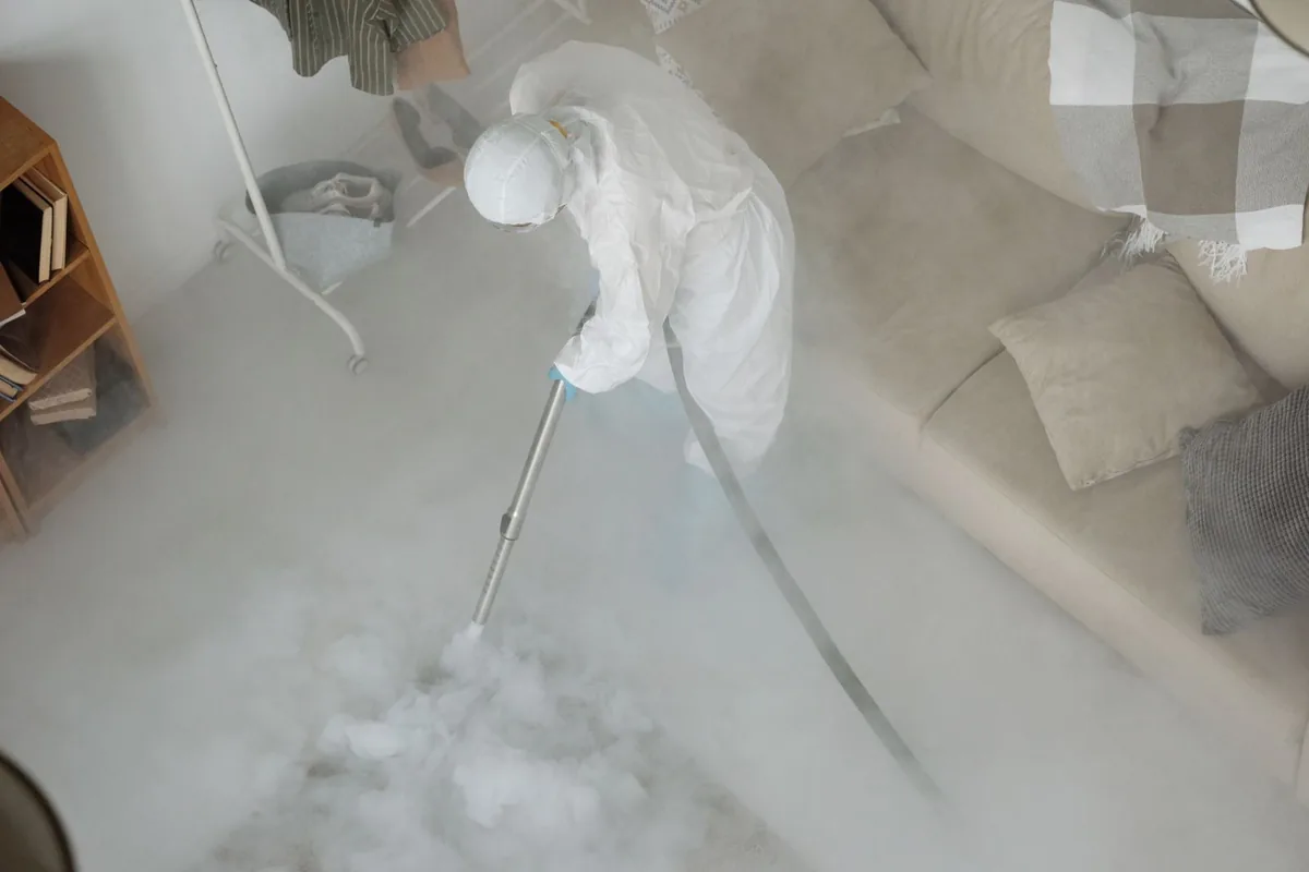 Biohazard cleanup technician in protective equipment, Belle Plaine, KS